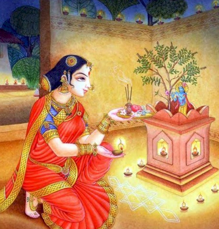 Devotee worshipping Tulsi plant.